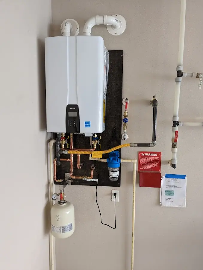 Professional plumber installing copper piping in a Odessa home